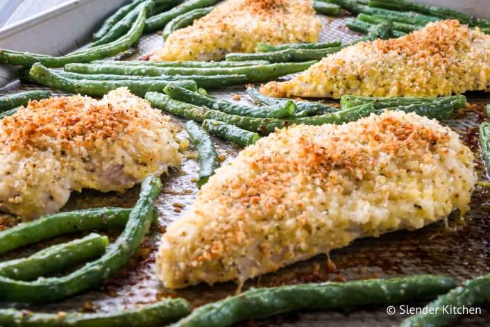 Lemon Pepper Chicken with green beans on a sheet pan.