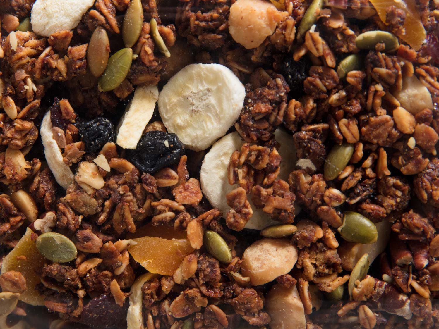 homemade granola with banana puree, dried fruits, and toasted nuts