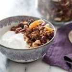 a bowl of yogurt with banana granola