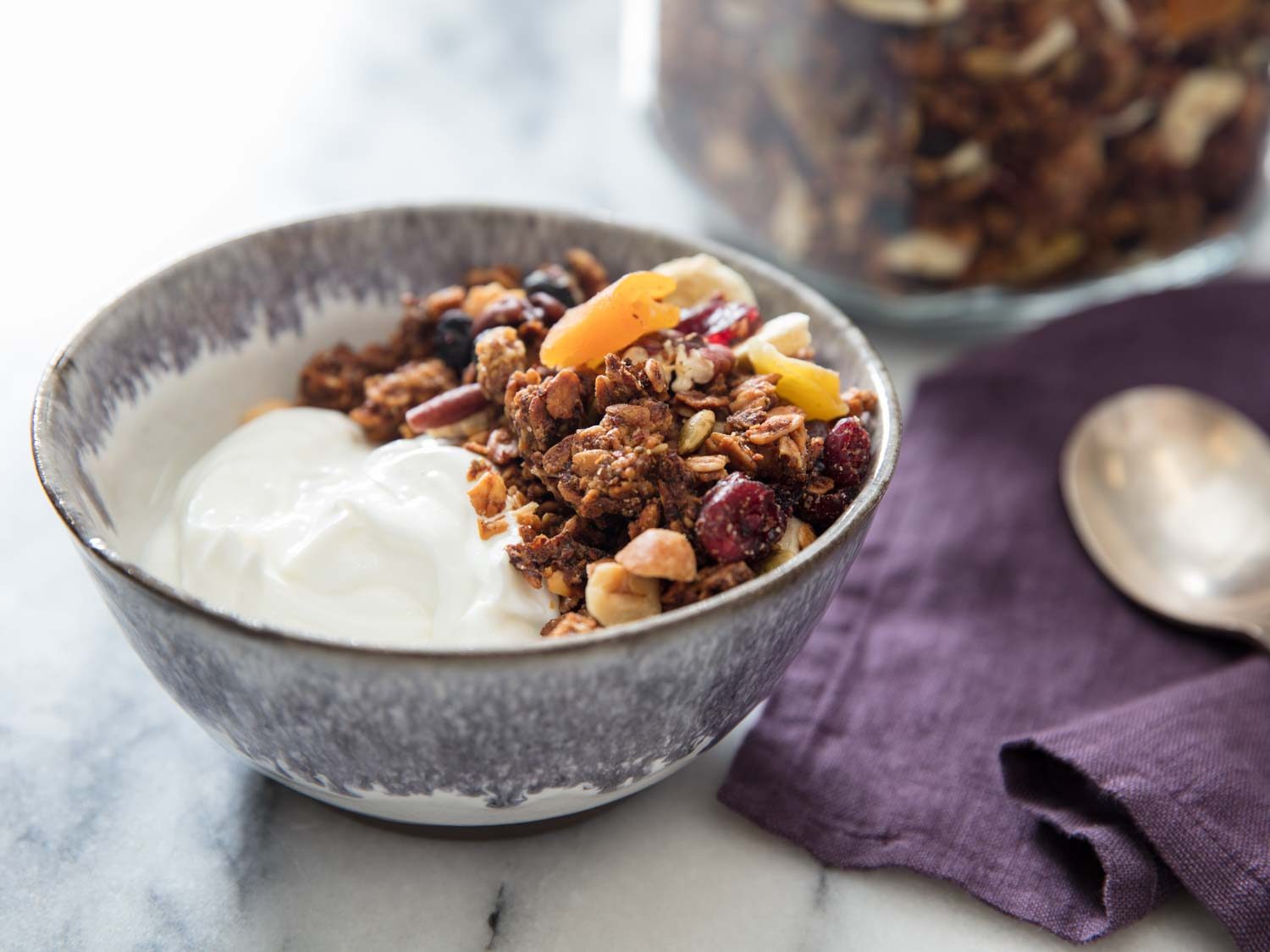 a bowl of yogurt with banana granola